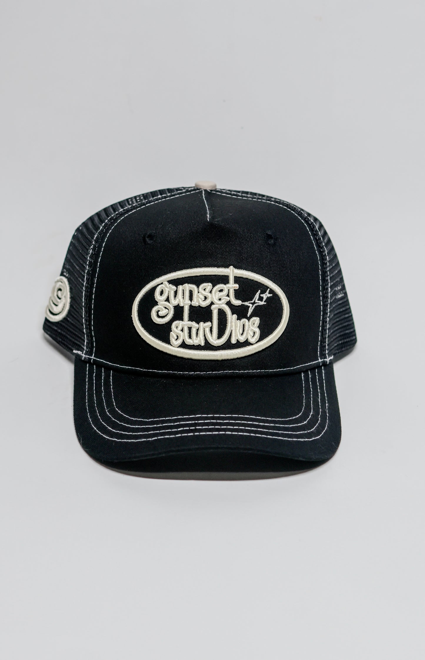 BLACK WITH WHITE STITCHING TRUCKER HAT