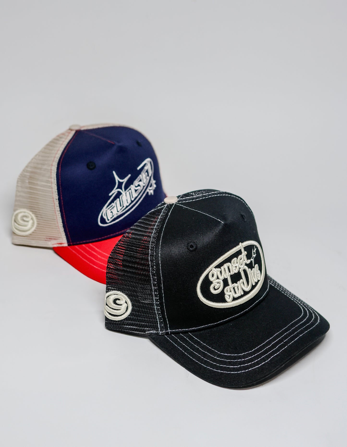 BLACK WITH WHITE STITCHING TRUCKER HAT
